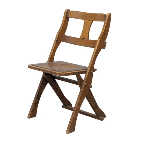 815 - A set of 4 Early 20th Century church folding chairs by The Drifter.