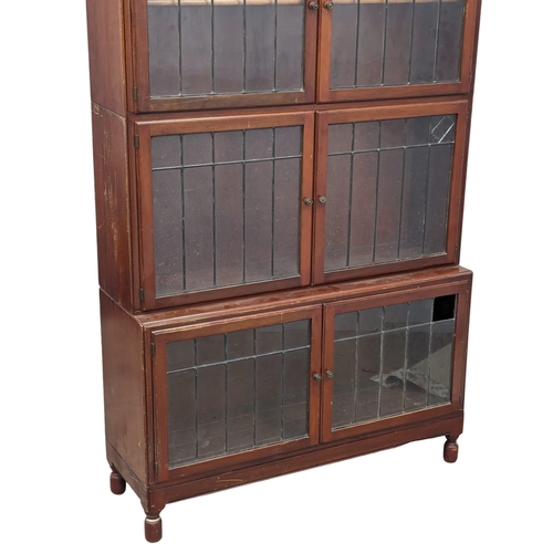 818 - An Early 20th Century mahogany stacking bookcase with astragal glazed doors by Minty. 89x30x150cm