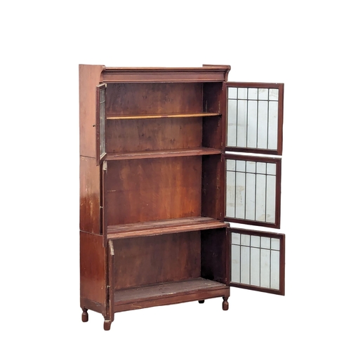 818 - An Early 20th Century mahogany stacking bookcase with astragal glazed doors by Minty. 89x30x150cm