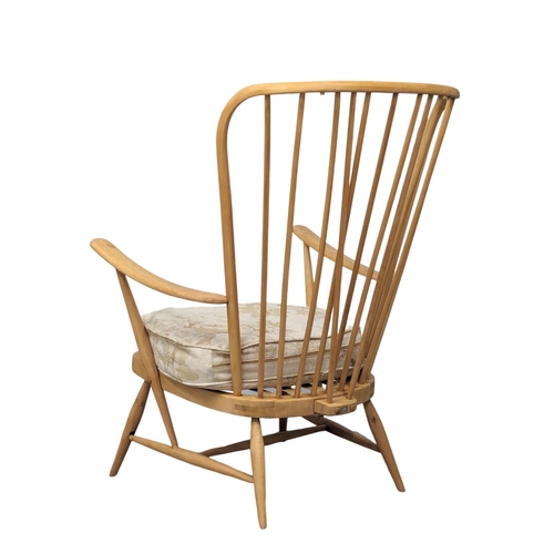 820 - An Ercol Blonde Mid Century elm and beech armchair. Model 914.