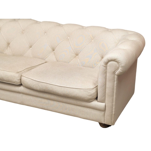 828 - A large Victorian style deep button back Chesterfield sofa. 203cm