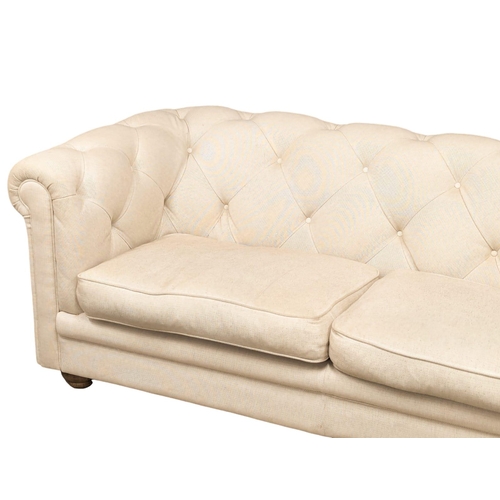 828 - A large Victorian style deep button back Chesterfield sofa. 203cm