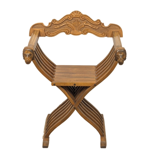 833 - An ornate beech X-framed chair