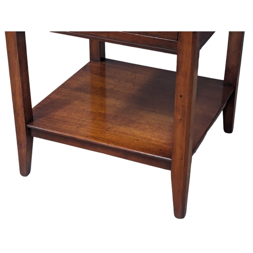 904 - A mahogany 2 tiered lamp table by Kennedy Furniture. 56x65cm