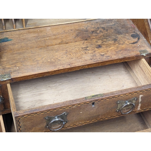 928 - An Early 20th Century Arts & Crafts inlaid oak writing bureau. Circa 1900. 100x43x111cm