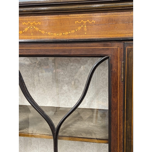 929 - An Edwardian inlaid mahogany display cabinet. 90x32x159cm