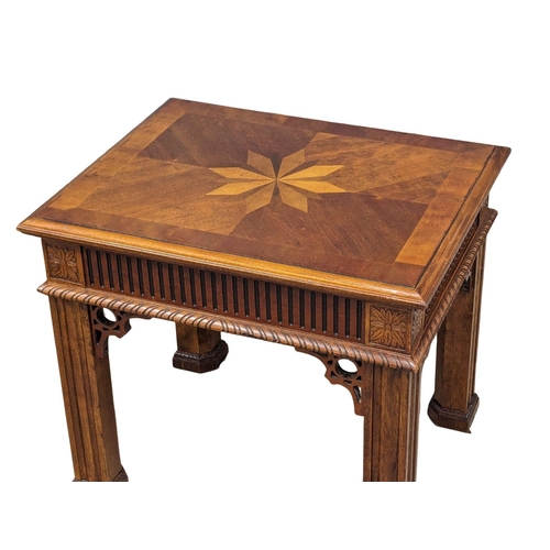 955 - An ornate end table. 67.5x55x58.5cm