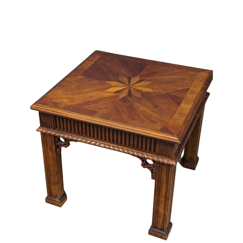 956 - An ornate end table. 67x58.5cm