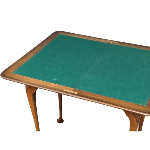 968 - An Early 20th Century burr walnut games table. Circa 1920s-1930s. 76.5x46.574cm