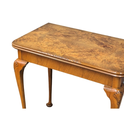 968 - An Early 20th Century burr walnut games table. Circa 1920s-1930s. 76.5x46.574cm