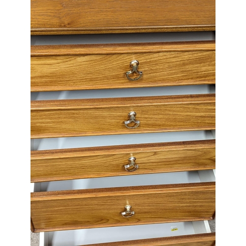 973 - A Mid Century teak chest of drawers by Program. 67x42x96.5cm