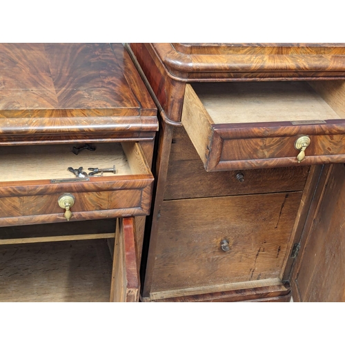 974 - A Mid Victorian mahogany pedestal sideboard with writing compartment. Circa 1860s. 217cm