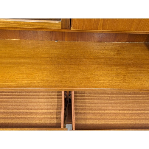 975 - A large McIntosh Mid Century teak living room unit. 180x41x193cm