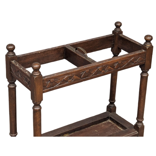 985 - An Early 20th Century oak stick stand. 61x26x65cm