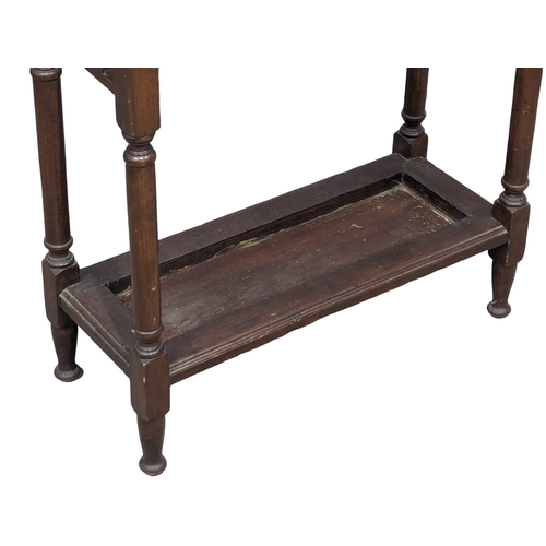 985 - An Early 20th Century oak stick stand. 61x26x65cm