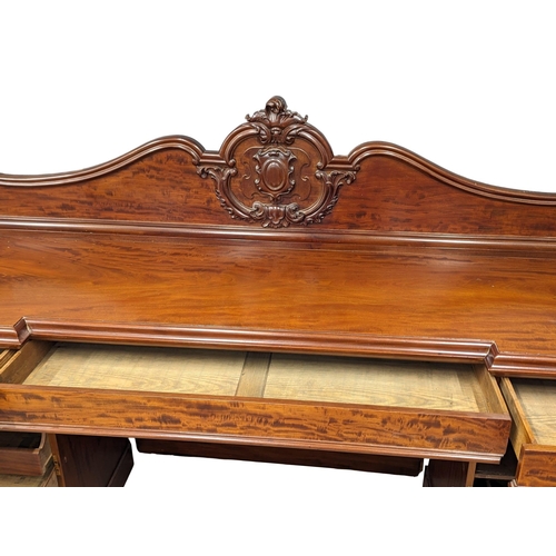 987 - A large Victorian mahogany pedestal sideboard. 234x68.5x145.5cm