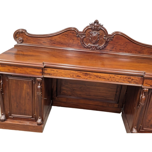 987 - A large Victorian mahogany pedestal sideboard. 234x68.5x145.5cm