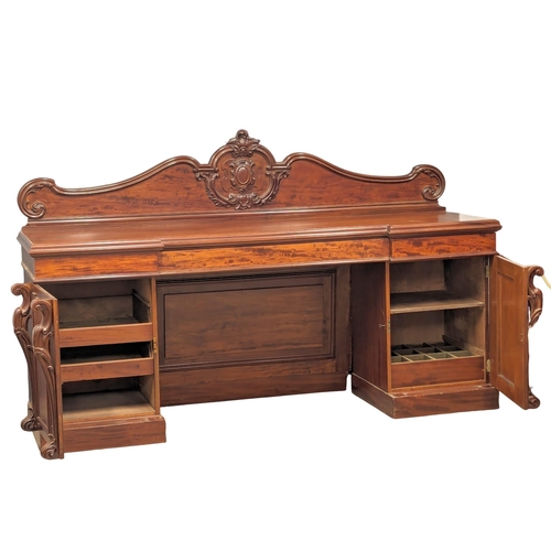 987 - A large Victorian mahogany pedestal sideboard. 234x68.5x145.5cm