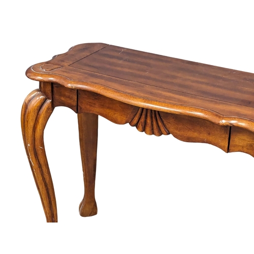 989 - An ornate mahogany hall table on Cabriole legs. 95x42x75cm