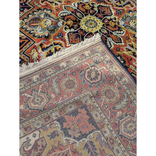 998 - A large vintage rug. 351x250cm