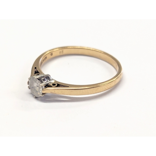 540F - A 9ct gold and diamond ring. 1.8g. Size UK N.