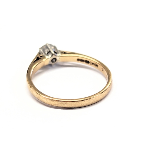 540F - A 9ct gold and diamond ring. 1.8g. Size UK N.