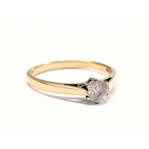 540F - A 9ct gold and diamond ring. 1.8g. Size UK N.