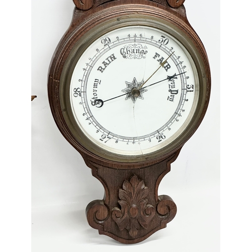 687 - A Late Victorian oak barometer with an Early 20th Century oak barometer. 85cm