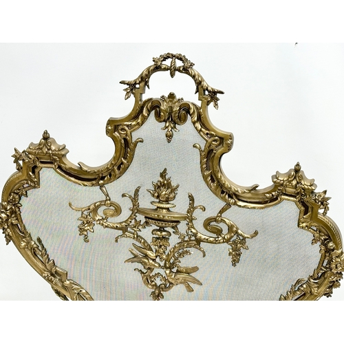 356D - A vintage French 18th Century style Rococo brass firescreen with wire mesh panel. 70x79cm