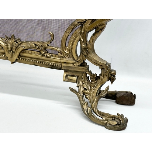 356D - A vintage French 18th Century style Rococo brass firescreen with wire mesh panel. 70x79cm