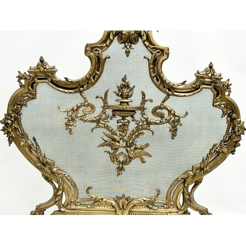 356D - A vintage French 18th Century style Rococo brass firescreen with wire mesh panel. 70x79cm