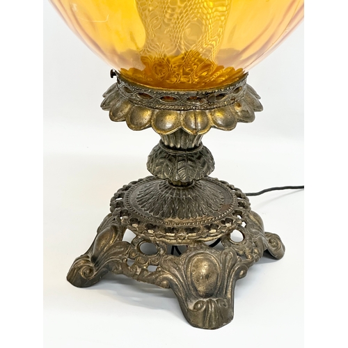 688 - A large Falkenstein ornate brass table lamp. 61cm