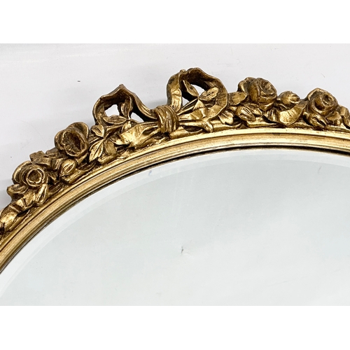 356E - A vintage gilt framed bevelled mirror. 54x57.5cm