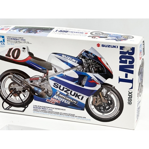 637D - 2 Tamiya model kits. A Tamiya Honda NSR 500. A Tamiya Suzuki RGV-1.