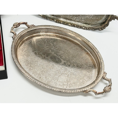 696 - Silver plated trays. Including a Parkin Silvercraft food server. Largest tray 53cm