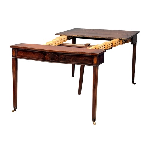 954 - A Sheraton style inlaid mahogany turnover tea table/dining table