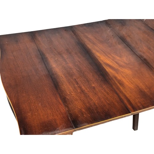 954 - A Sheraton style inlaid mahogany turnover tea table/dining table