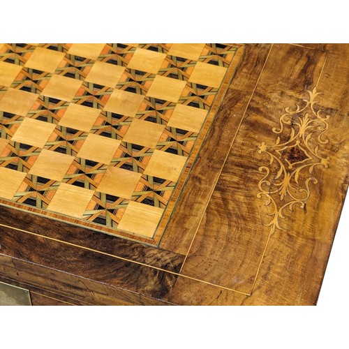 957 - A Victorian inlaid walnut turnover games table. 58x38x72.5cm