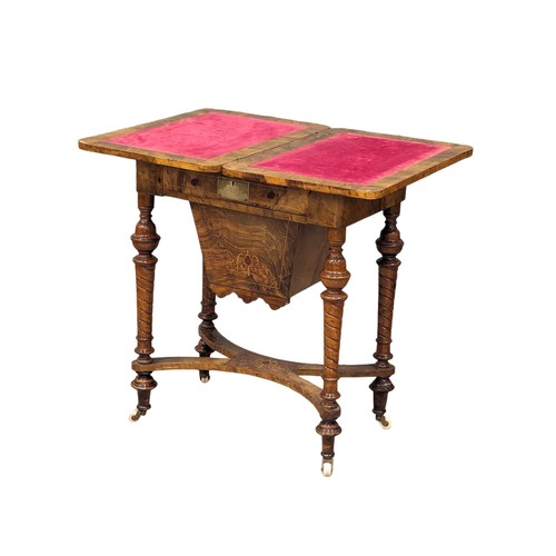 957 - A Victorian inlaid walnut turnover games table. 58x38x72.5cm