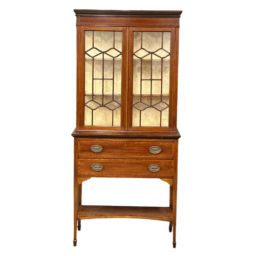 1014 - An Early 20th Century Sheraton Revival inlaid mahogany bookcase with 2 drawers. 83.5x42x183.5cm