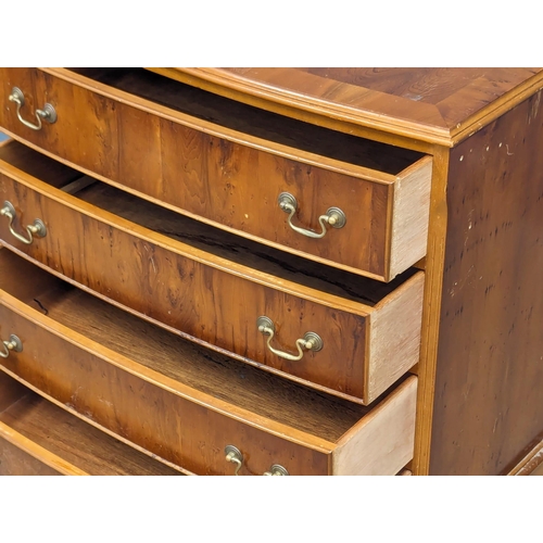 1015 - A Georgian style yew wood bow front chest of drawers. 73x43.5x80.5cm