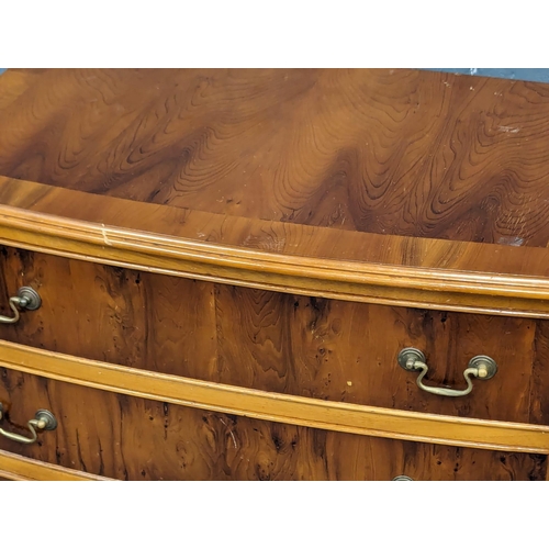 1015 - A Georgian style yew wood bow front chest of drawers. 73x43.5x80.5cm