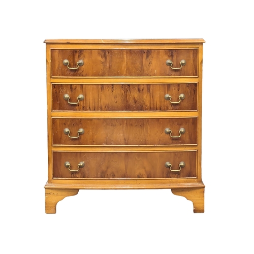 1015 - A Georgian style yew wood bow front chest of drawers. 73x43.5x80.5cm