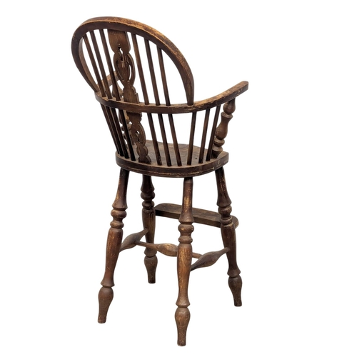 1017 - A Late 19th Century elm and beech Windsor style child's highchair.