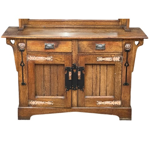 1018 - A Late 19th Century Arts & Crafts oak mirror back sideboard with copper and iron panels. Circa 1890-... 