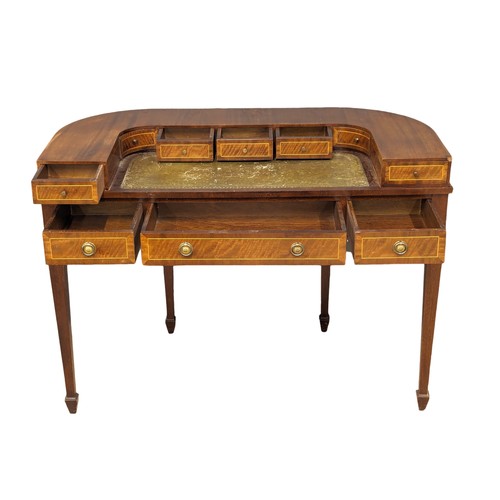 1025 - A Carlton House style inlaid mahogany writing desk with leather top in the manner of Sheraton 116x57... 