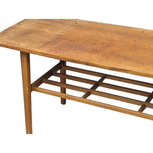 1026 - A Mid Century teak 2 tiered coffee table by Nathan. 107x40.5x45.5cm