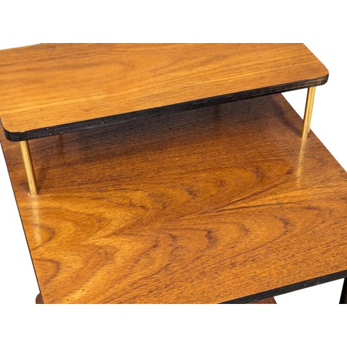 1028 - A pair of 1960s Mid Century teak 3 tiered side tables. 37.5x37x57cm