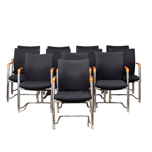 1029 - A set of 12 Havana desk chairs / armchairs.