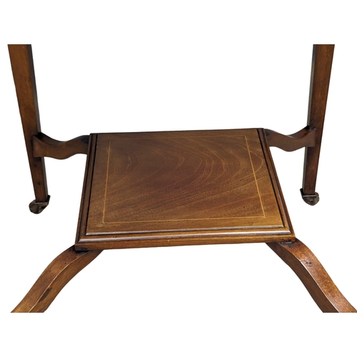 1030 - An Edwardian inlaid mahogany envelope turnover games table. 53.5x77.5cm